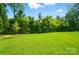 Expansive backyard featuring a lush green lawn, perfect for outdoor activities and relaxation at 9846 Quercus Ln, Huntersville, NC 28078