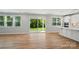 Bright living space with sliding doors to the backyard, with an island and kitchen in view at 9846 Quercus Ln, Huntersville, NC 28078