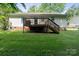 Backyard with a wooden deck and green grass at 1013 Ashwood Pl, Salisbury, NC 28146