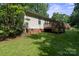 Backyard with a wooden deck and green grass at 1013 Ashwood Pl, Salisbury, NC 28146
