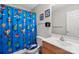 Cheerful bathroom with a themed shower curtain and updated fixtures at 1013 Ashwood Pl, Salisbury, NC 28146