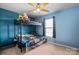 Blue themed room with a bunk bed, fan, and window at 1013 Ashwood Pl, Salisbury, NC 28146