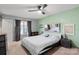 Comfortable bedroom with a ceiling fan, natural light and ample space at 1013 Ashwood Pl, Salisbury, NC 28146