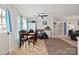 Open dining area with tile floors, wooden table set, and good light exposure at 1013 Ashwood Pl, Salisbury, NC 28146