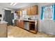 The efficient kitchen features stainless steel appliances and a bright window at 1013 Ashwood Pl, Salisbury, NC 28146
