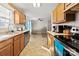 Well-lit kitchen with stainless steel appliances and a view into the spacious living area at 1013 Ashwood Pl, Salisbury, NC 28146