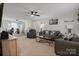 Spacious living room with a ceiling fan, comfortable gray sofas, and ample natural light at 1013 Ashwood Pl, Salisbury, NC 28146