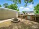 Backyard features a small fire pit, grass, and shed at 1015 Rhode Island Ave, Kannapolis, NC 28083