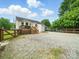 The backyard features a wooden deck and a large, gravel parking area at 1015 Rhode Island Ave, Kannapolis, NC 28083
