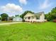 Spacious lawn view of home showcasing its well-kept landscape and classic design elements at 1015 Rhode Island Ave, Kannapolis, NC 28083