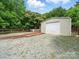 Features a detached one car garage with a gravel driveway at 1015 Rhode Island Ave, Kannapolis, NC 28083