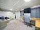 The living room has comfortable seating, a television, and carpeted floors at 1015 Rhode Island Ave, Kannapolis, NC 28083