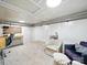 The living room has a study space, a comfortable chair, and plush carpet at 1015 Rhode Island Ave, Kannapolis, NC 28083