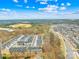 Aerial view of a residential community featuring townhomes, streets, and surrounding landscapes at 1022 Maltby St, Charlotte, NC 28217