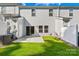 A small backyard featuring a concrete patio and green lawn, ideal for outdoor living at 1022 Maltby St, Charlotte, NC 28217