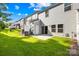 A well-maintained backyard with a small concrete patio, perfect for outdoor relaxation and entertaining at 1022 Maltby St, Charlotte, NC 28217