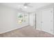 Carpeted bedroom featuring ceiling fan, and ensuite bathroom at 1022 Maltby St, Charlotte, NC 28217