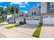 Townhome exterior with gray siding, stone accents, and a two-car garage at 1022 Maltby St, Charlotte, NC 28217