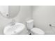 Small half bath features a vessel sink and modern fixtures at 1022 Maltby St, Charlotte, NC 28217
