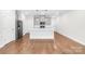 Modern kitchen with island, stainless steel appliances, and gray cabinets at 1022 Maltby St, Charlotte, NC 28217