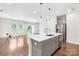 Kitchen island with stainless steel appliances and view of backyard at 1022 Maltby St, Charlotte, NC 28217