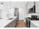 Modern kitchen featuring stainless steel appliances, island sink and gas range at 1022 Maltby St, Charlotte, NC 28217