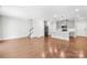 Bright open-concept living room and kitchen with hardwood floors and stainless appliances at 1022 Maltby St, Charlotte, NC 28217