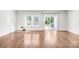 Bright living room with hardwood floors, large windows and sliding glass door at 1022 Maltby St, Charlotte, NC 28217
