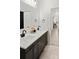 Stylish bathroom featuring a double vanity, dark cabinetry, and elegant marble countertops at 103 Wadesborough Pl, Wadesboro, NC 28170