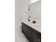 Elegant bathroom featuring dark cabinetry, a marble countertop, and modern fixtures at 103 Wadesborough Pl, Wadesboro, NC 28170