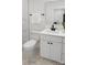Modern bathroom featuring a sleek vanity with stone countertop, updated fixtures, and a tiled shower at 103 Wadesborough Pl, Wadesboro, NC 28170