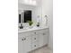 Stylish bathroom showcasing a double vanity with stone countertop, dark fixtures, and contemporary design at 103 Wadesborough Pl, Wadesboro, NC 28170