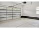 Spacious garage with functional door, painted walls and painted base trim at 103 Wadesborough Pl, Wadesboro, NC 28170