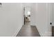 A clean hallway leading to bedroom with new floors and neutral fresh paint at 103 Wadesborough Pl, Wadesboro, NC 28170