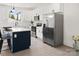 Modern kitchen with white cabinets, marble countertops, black hardware and stainless steel appliances at 103 Wadesborough Pl, Wadesboro, NC 28170