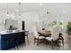 Open kitchen and dining area featuring white cabinets, a kitchen island with bar stools and plenty of space at 103 Wadesborough Pl, Wadesboro, NC 28170