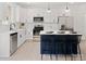 Bright kitchen with white cabinets, white countertop, island with seating and modern appliances at 103 Wadesborough Pl, Wadesboro, NC 28170