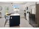 Bright kitchen featuring white cabinets, a large kitchen island, stainless steel appliances, and a window at 103 Wadesborough Pl, Wadesboro, NC 28170