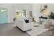 Bright, open living room with white walls and contemporary furnishings providing a comfortable space at 103 Wadesborough Pl, Wadesboro, NC 28170