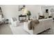 Bright living room with white walls, modern decor, stylish furnishings, and lots of natural light at 103 Wadesborough Pl, Wadesboro, NC 28170