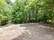 Level lot nestled among mature trees providing privacy and shade at 1117 Hidden Brook Ln, Clover, SC 29710