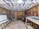 Unfinished basement that is ready for customization with workbench, ladder, and overhead lighting at 1117 Hidden Brook Ln, Clover, SC 29710