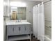 This bathroom has a single sink vanity with white quartz countertops and a shower/tub combo at 1117 Hidden Brook Ln, Clover, SC 29710