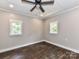 This bedroom has a ceiling fan and two windows for plenty of natural light at 1117 Hidden Brook Ln, Clover, SC 29710