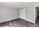 This bedroom has a closet and attractive dark wood flooring at 1117 Hidden Brook Ln, Clover, SC 29710