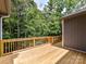 A wooden deck is a perfect place to relax and enjoy the scenic views of the surrounding greenery at 1117 Hidden Brook Ln, Clover, SC 29710