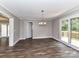 A spacious dining room with hardwood floors that leads to a deck for outdoor entertaining at 1117 Hidden Brook Ln, Clover, SC 29710