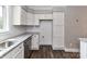 A modern kitchen showcasing white cabinets, updated counters and fixtures, with stainless steel appliances at 1117 Hidden Brook Ln, Clover, SC 29710