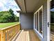Wooden porch with a view of the lush green lawn and trees, perfect for relaxing outdoors at 1117 Hidden Brook Ln, Clover, SC 29710