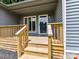 Inviting wooden porch with a glass door and windows, offering a cozy entrance to the home at 1117 Hidden Brook Ln, Clover, SC 29710